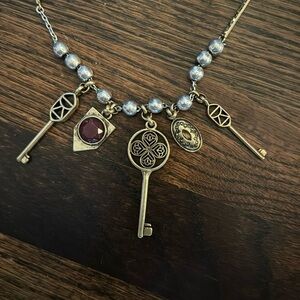 NWT Lucky Brand silver & gold necklace. Silver chain and beads, gold charms.